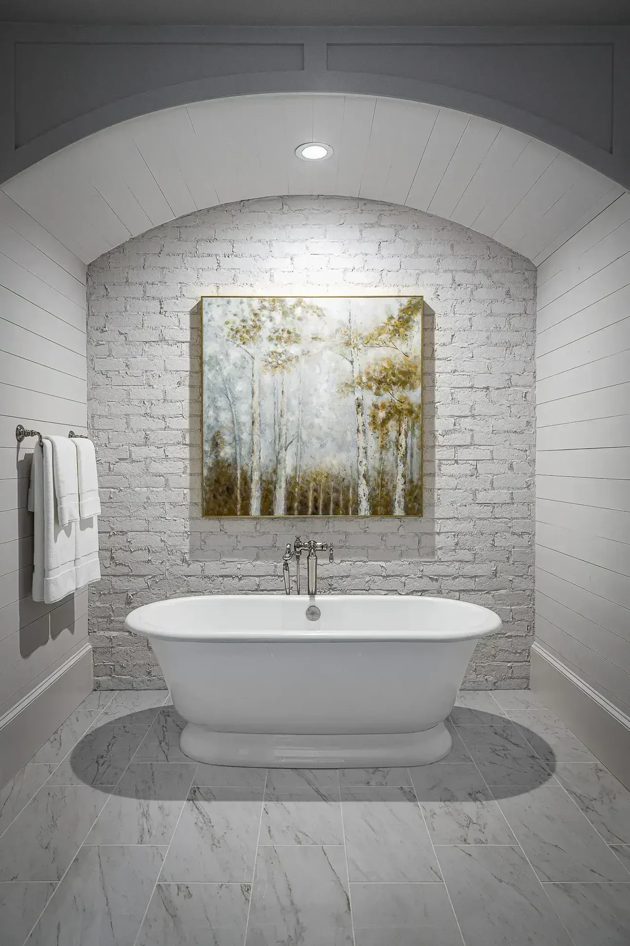 Chic bathroom featuring a freestanding tub against a white brick wall, designed by Michael James Remodeling. Chic bathroom featuring a freestanding tub against a white brick wall, designed by Michael James Remodeling.