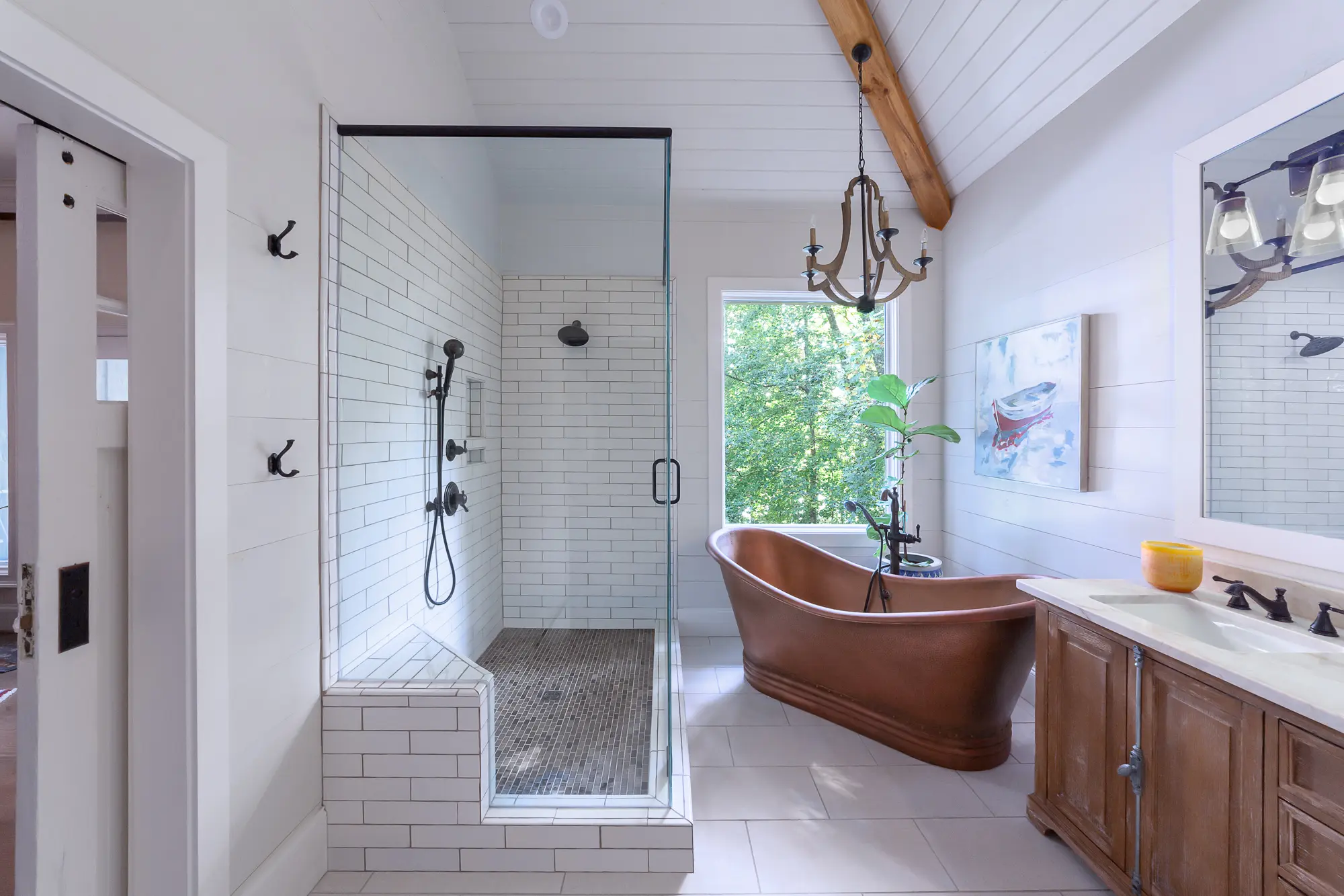Luxurious bathroom with freestanding copper tub and walk-in shower by Michael James Remodeling.