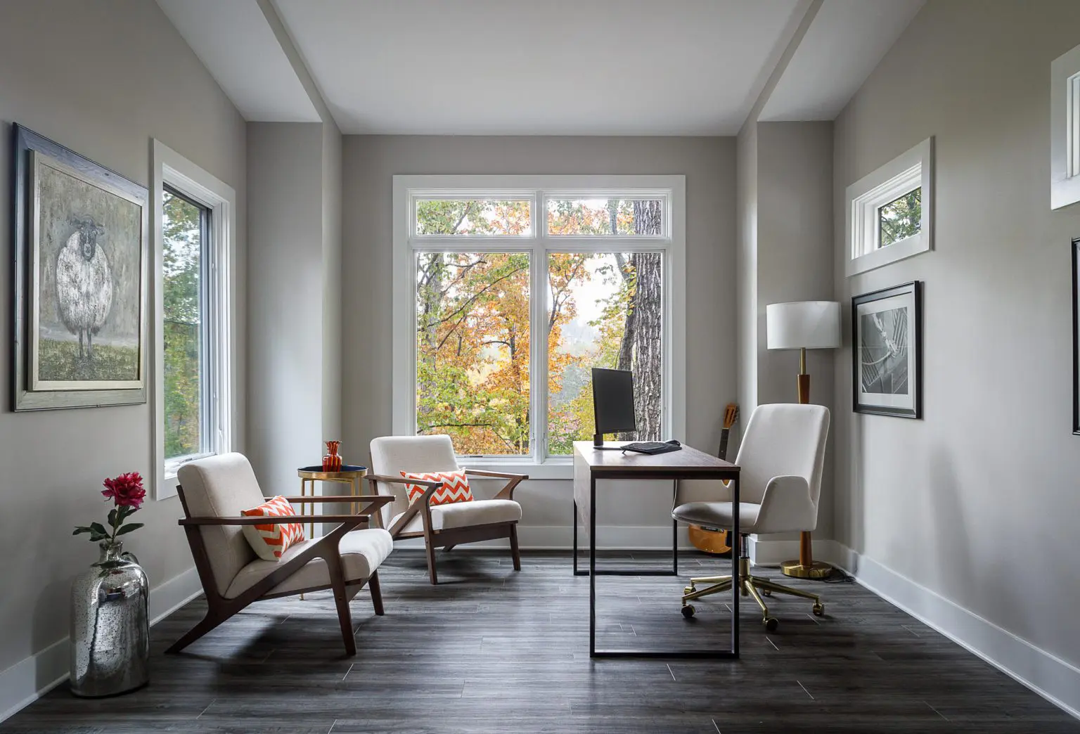 Home office with natural light, contemporary furniture, and hardwood floors. Home office with natural light, contemporary furniture, and hardwood floors.